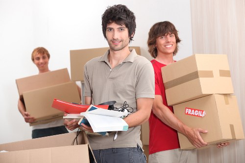 Packed boxes and protected furniture ready for a house move