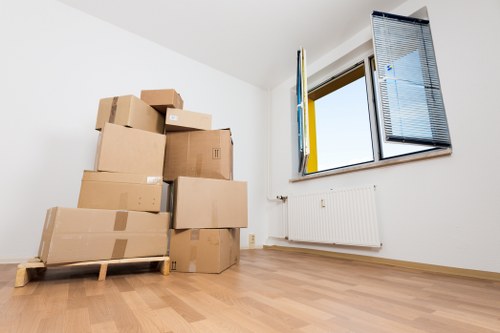 Removal crew navigating stairs in a Covent Garden property