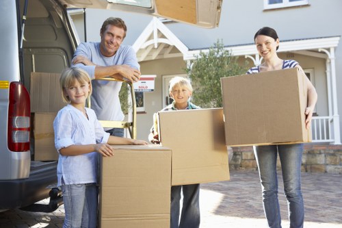 Central London man and van team handling boxes and household items