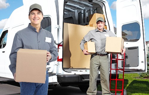 Furniture and packed items organised for transport in central London