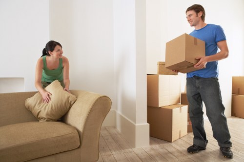 Careful unloading of household items at a new home in central London